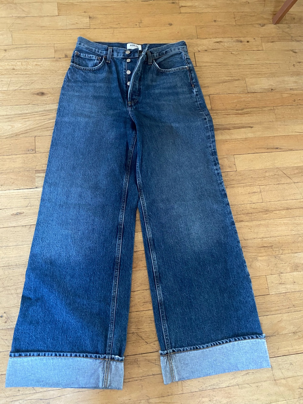 AGOLDE jeans. Size 27.  Button Closure. Cuffed bottom.